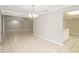 Open-concept dining area with tile floors, modern lighting, and easy access to the kitchen at 1001 Meadowcrest Dr, Valrico, FL 33594