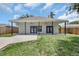 Spacious backyard with covered patio, perfect for entertaining or relaxation at 4413 W Wallcraft Ave, Tampa, FL 33611