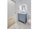 Bathroom featuring modern vanity, a stylish mirror, and tile flooring at 4413 W Wallcraft Ave, Tampa, FL 33611