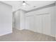 Bedroom with a ceiling fan and carpet, and a closet with double doors at 4413 W Wallcraft Ave, Tampa, FL 33611