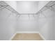 Empty walk-in closet with metal shelving for efficient and flexible storage solutions at 4413 W Wallcraft Ave, Tampa, FL 33611