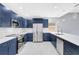 Modern kitchen featuring an island, stainless steel appliances, and abundant cabinet space at 4413 W Wallcraft Ave, Tampa, FL 33611