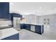 Modern kitchen featuring an island, stainless steel appliances, and abundant cabinet space at 4413 W Wallcraft Ave, Tampa, FL 33611
