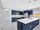 Modern kitchen featuring an island, stainless steel appliances, and abundant cabinet space at 4413 W Wallcraft Ave, Tampa, FL 33611