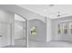 Bright and airy living room featuring neutral walls, a ceiling fan, and ample natural light at 4413 W Wallcraft Ave, Tampa, FL 33611