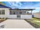 Exterior view of a screened patio with exterior door and patio area at 8701 Thornwood Ln, Tampa, FL 33615