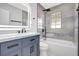 Modern bathroom featuring a stylish vanity, contemporary fixtures, and a bathtub-shower combo at 8701 Thornwood Ln, Tampa, FL 33615