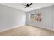 Bright bedroom featuring a large window offering plenty of natural light and wood floors at 8701 Thornwood Ln, Tampa, FL 33615