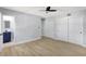 Spacious main bedroom with wood floors featuring an ensuite bathroom and plenty of closet space at 8701 Thornwood Ln, Tampa, FL 33615