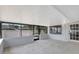 Enclosed patio featuring tile floors, white walls, and screen windows at 8701 Thornwood Ln, Tampa, FL 33615