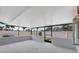 Enclosed patio featuring tile floors, white walls, and screen windows at 8701 Thornwood Ln, Tampa, FL 33615