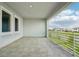 Spacious balcony featuring tile floors, modern railing and a view of the community at 9201 Sanders Tree Loop, Wesley Chapel, FL 33545