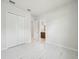 Bright bedroom featuring a closet and an en suite bathroom at 9201 Sanders Tree Loop, Wesley Chapel, FL 33545