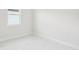 Bright bedroom with a window and white marble flooring at 9201 Sanders Tree Loop, Wesley Chapel, FL 33545