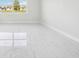 Bright and airy bedroom with marble floors and a large window at 9201 Sanders Tree Loop, Wesley Chapel, FL 33545