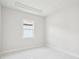 Bright bedroom featuring a window with white marble flooring at 9201 Sanders Tree Loop, Wesley Chapel, FL 33545