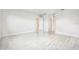 Spacious bedroom with marble flooring and multiple entry doors at 9201 Sanders Tree Loop, Wesley Chapel, FL 33545