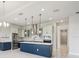 Modern kitchen with stainless steel appliances, a center island, and pendant lighting at 9201 Sanders Tree Loop, Wesley Chapel, FL 33545