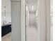 Walk-in pantry with shelving units provides ample storage space, next to the gourmet kitchen at 9201 Sanders Tree Loop, Wesley Chapel, FL 33545