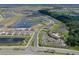 Wide aerial view of a planned community with ponds, amenities, and neatly arranged residential areas at 17127 Harvest Moon Way, Bradenton, FL 34211
