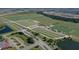 Expansive aerial view showcasing sports fields and recreational areas within a planned community at 17127 Harvest Moon Way, Bradenton, FL 34211