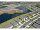 Overhead view of a residential community featuring ponds, lush landscaping, and well-maintained homes at 17127 Harvest Moon Way, Bradenton, FL 34211