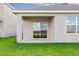 Covered patio overlooking a lush lawn, ideal for relaxation and enjoying the outdoor scenery at 17127 Harvest Moon Way, Bradenton, FL 34211