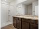 Bathroom has double sinks and walk-in shower at 17127 Harvest Moon Way, Bradenton, FL 34211