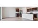 Bright kitchen features stainless steel appliances, granite countertops, and tiled floors at 17127 Harvest Moon Way, Bradenton, FL 34211