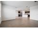 Open-concept living space with tiled floors that seamlessly connects to the kitchen, creating an inviting atmosphere at 17127 Harvest Moon Way, Bradenton, FL 34211
