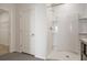 Clean, bright bathroom showcasing a walk-in shower, tile floors, and a door to the closet at 17127 Harvest Moon Way, Bradenton, FL 34211