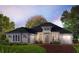 Inviting exterior elevation featuring a brick driveway, neutral siding, and two-car garage at 5001 Sea Branch Ave, Apollo Beach, FL 33572
