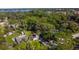 Aerial view of community features lush tree coverage and beautiful waterfront views at 5141 Mallet Dr, Port Richey, FL 34668