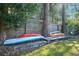 Spacious backyard featuring several kayaks and canoes, ideal for outdoor enthusiasts at 5141 Mallet Dr, Port Richey, FL 34668