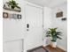 Bright entryway featuring a welcoming door, stylish decor, and a plant at 5141 Mallet Dr, Port Richey, FL 34668