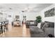 Spacious living room with modern furniture, light wood floors, and white walls at 5141 Mallet Dr, Port Richey, FL 34668