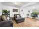 Bright living room with contemporary furnishings, plants, and neutral tones at 5141 Mallet Dr, Port Richey, FL 34668