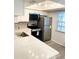 Updated kitchen with stainless steel appliances, ample cabinet space, and modern countertops at 821 Patricia Ave # 202, Dunedin, FL 34698