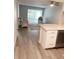 The living room showcases hardwood flooring and open-concept design, complemented by the modern kitchen at 821 Patricia Ave # 202, Dunedin, FL 34698