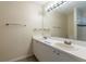 Bright bathroom featuring a dual sink vanity, offering ample space and functionality at 7814 34Th E Ct, Sarasota, FL 34243