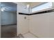Shower room with white tiles, showcasing a clean and simple design at 7814 34Th E Ct, Sarasota, FL 34243