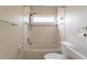 Clean white bathroom with a tub/shower combination and classic fixtures at 7814 34Th E Ct, Sarasota, FL 34243