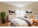 Stylishly furnished bedroom with natural light, a cozy rug, and tasteful wall art at 7814 34Th E Ct, Sarasota, FL 34243