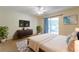 Bedroom with a ceiling fan and access to an outdoor space, providing a relaxing atmosphere at 7814 34Th E Ct, Sarasota, FL 34243