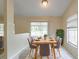 Bright dining area featuring a modern table with seating for six and natural light at 7814 34Th E Ct, Sarasota, FL 34243