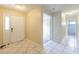 Bright foyer with tile floors and an open view of the living spaces at 7814 34Th E Ct, Sarasota, FL 34243