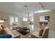Spacious living room with tile flooring, neutral decor, and lots of natural light at 7814 34Th E Ct, Sarasota, FL 34243