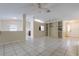Open living room featuring tile flooring, and a built-in shelving unit; perfect for entertaining at 7814 34Th E Ct, Sarasota, FL 34243