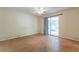 Empty room with a sliding door to a patio, offering great natural light and outdoor access at 7814 34Th E Ct, Sarasota, FL 34243