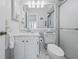 Fresh bathroom featuring a walk-in shower, an updated vanity, and a neutral color palette at 11923 Boynton Ln # B, New Port Richey, FL 34654
